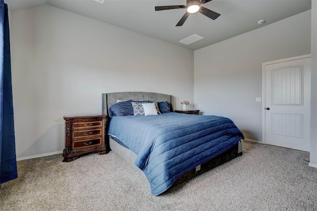 bedroom featuring visible vents, lofted ceiling, a ceiling fan, carpet flooring, and baseboards