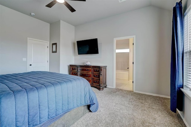 bedroom featuring a ceiling fan, connected bathroom, carpet, baseboards, and vaulted ceiling