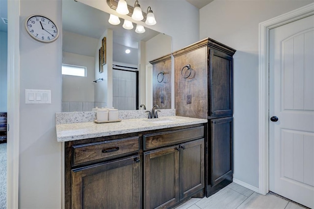full bath featuring tile patterned floors and vanity