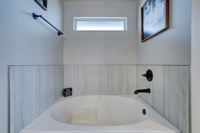 bathroom featuring a garden tub