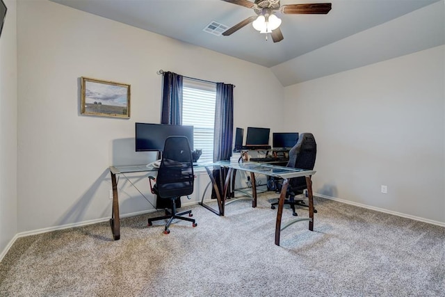 office area with baseboards, visible vents, lofted ceiling, ceiling fan, and carpet flooring