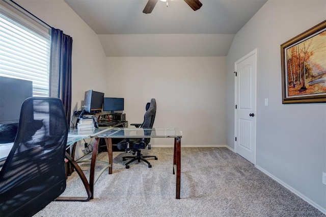 office space featuring baseboards, a ceiling fan, lofted ceiling, and carpet floors