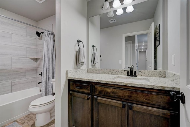 bathroom featuring visible vents, toilet, vanity, and shower / bath combination with curtain