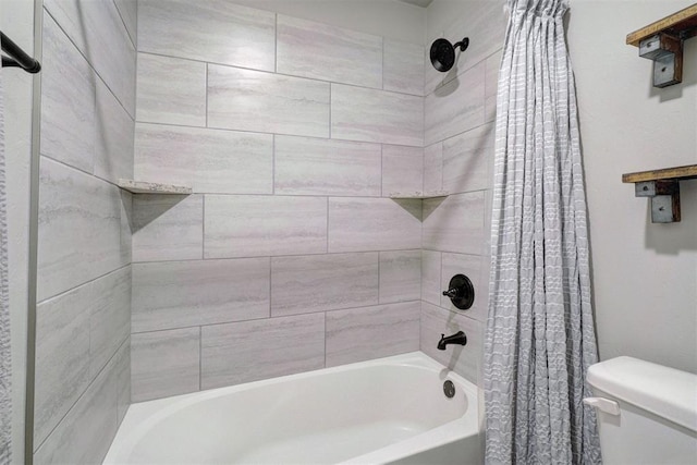 bathroom featuring toilet and shower / bath combination with curtain