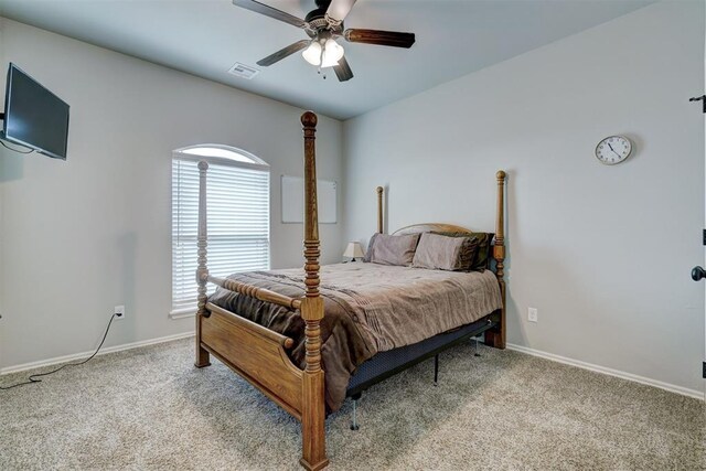 bedroom with carpet flooring, baseboards, and visible vents