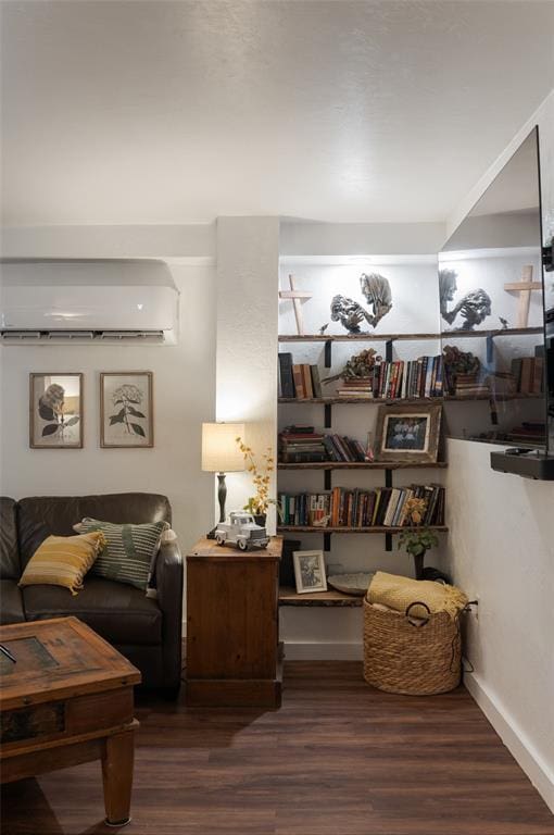 interior space featuring a wall unit AC and wood finished floors