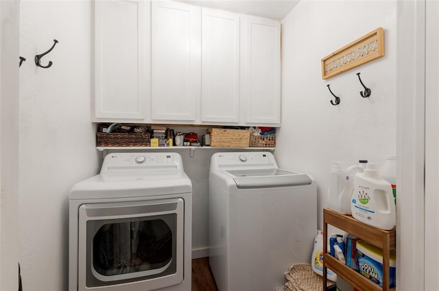 laundry area featuring washer and dryer and cabinet space