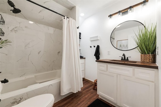 bathroom with toilet, shower / bath combo with shower curtain, vanity, and wood finished floors