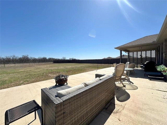 view of patio / terrace with a fenced backyard and an outdoor fire pit