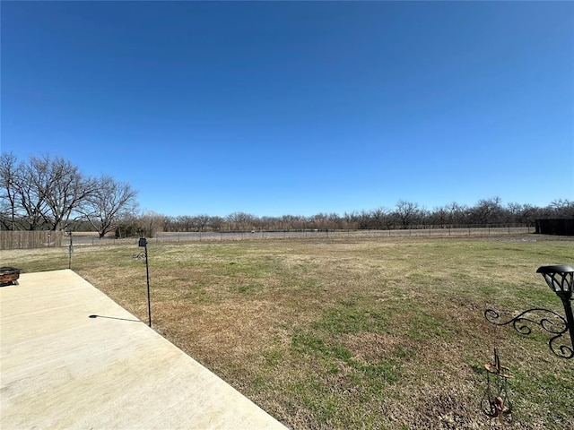 view of yard with a patio and fence