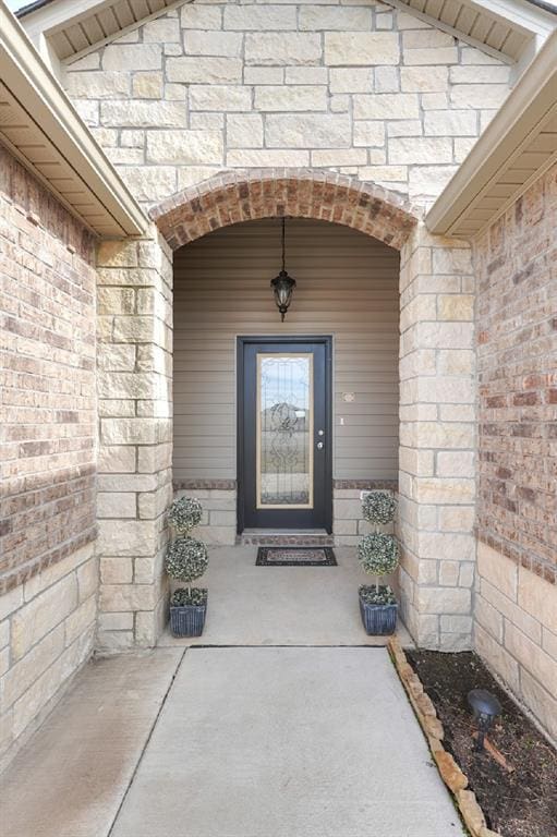 view of exterior entry with stone siding