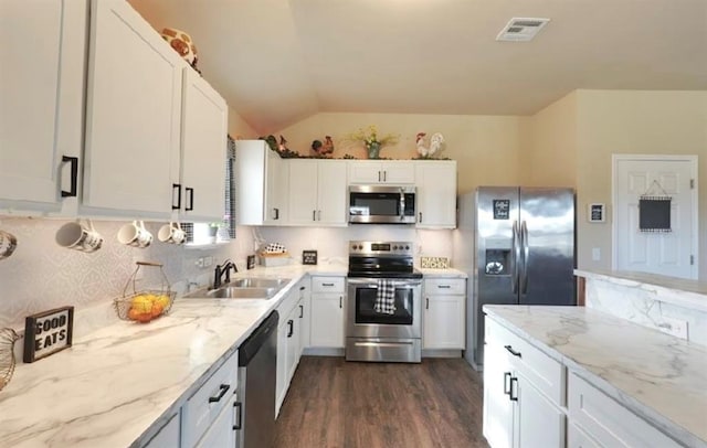 42195 Elles Way, Shawnee, OK 74804 - kitchen featuring stainless steel appliances, dark wood finished floors, white cabinets, tasteful backsplash, and light stone counters