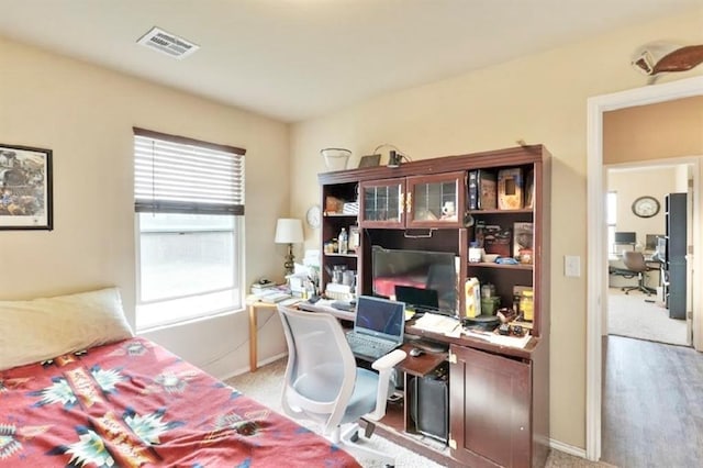 42195 Elles Way, Shawnee, OK 74804 - bedroom with an office area and light carpet