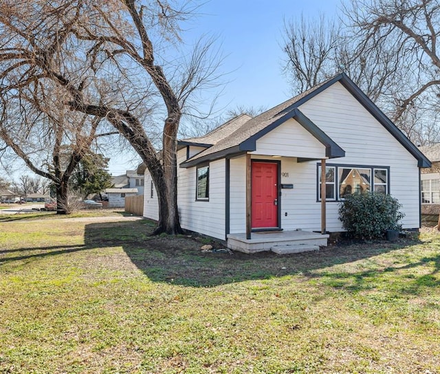 bungalow-style house featuring a front yard