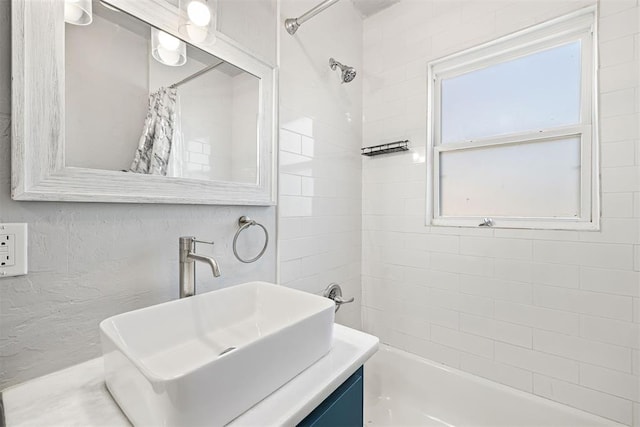 bathroom featuring vanity and shower / tub combo