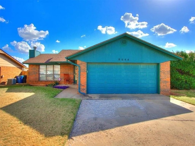 ranch-style house with a chimney, brick siding, an attached garage, and a front lawn