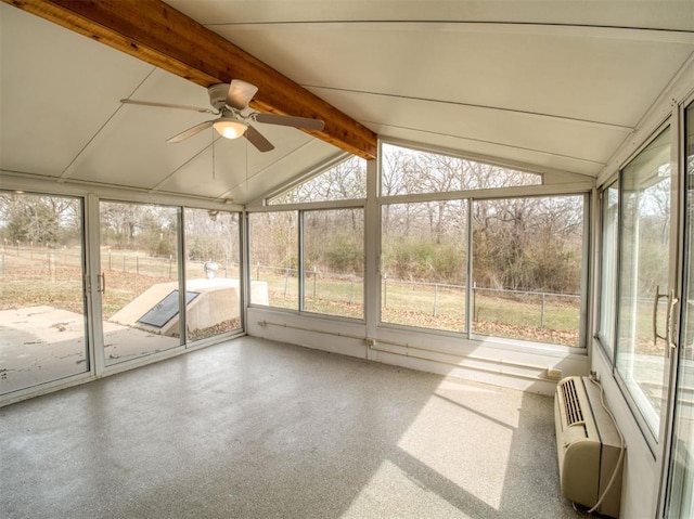 unfurnished sunroom featuring vaulted ceiling with beams, ceiling fan, and a wall unit AC