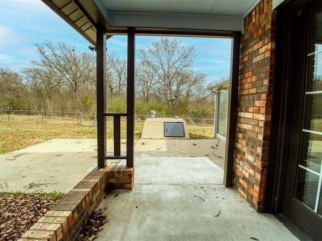 view of patio featuring fence