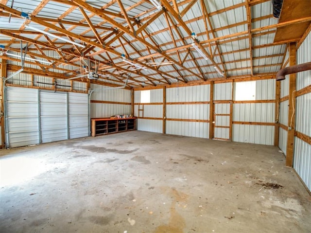 garage with metal wall and a garage door opener