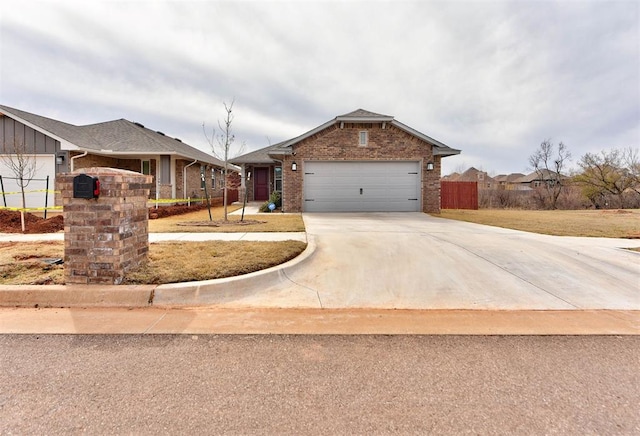 ranch-style house featuring fence, board and batten siding, concrete driveway, a garage, and brick siding