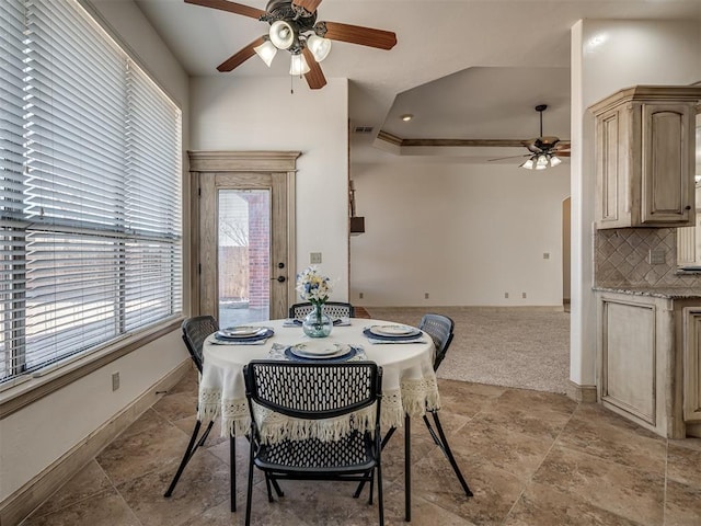 dining room with visible vents, a ceiling fan, and baseboards