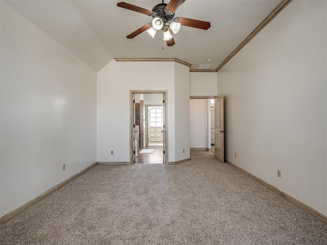 unfurnished bedroom featuring light colored carpet, baseboards, ensuite bathroom, and ornamental molding