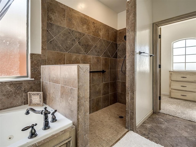 full bathroom featuring a walk in shower and a whirlpool tub