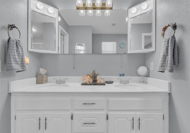 full bathroom featuring a sink and double vanity