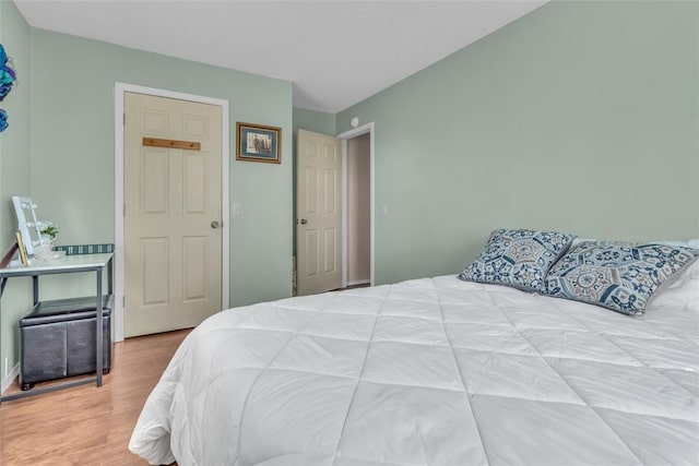 bedroom with wood finished floors