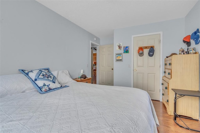 bedroom featuring wood finished floors