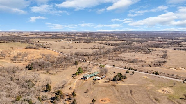 drone / aerial view featuring a rural view and view of desert