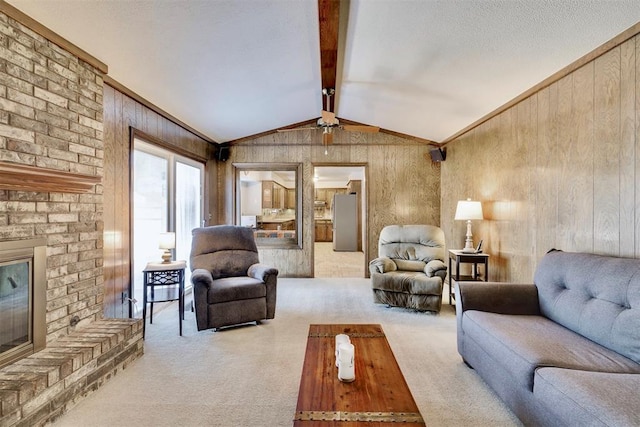 carpeted living area featuring vaulted ceiling with beams, ornamental molding, wood walls, a textured ceiling, and a brick fireplace