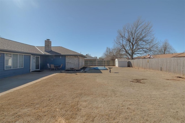 view of yard with a fenced backyard and a patio area