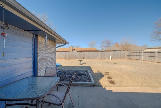 exterior space featuring a vegetable garden and a fenced backyard