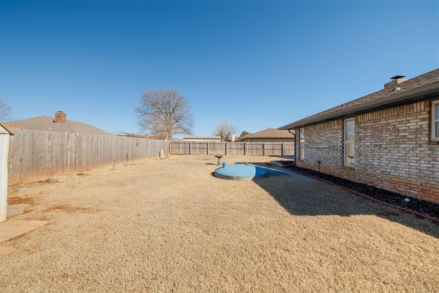 view of yard featuring a fenced backyard