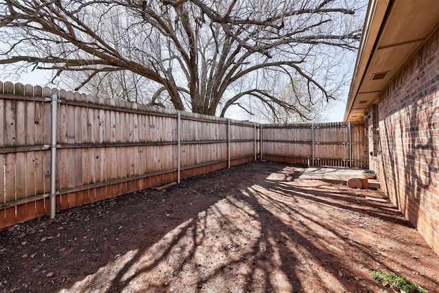 view of yard with a fenced backyard