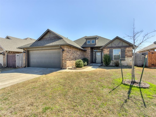 view of front of property with brick siding, fence, concrete driveway, roof with shingles, and a garage