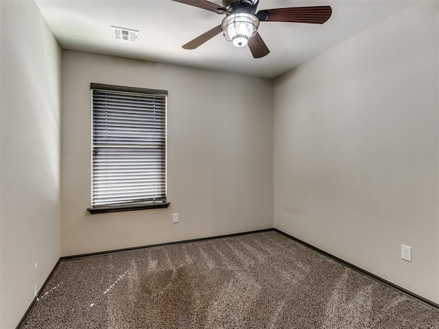 carpeted empty room featuring a ceiling fan, baseboards, and visible vents