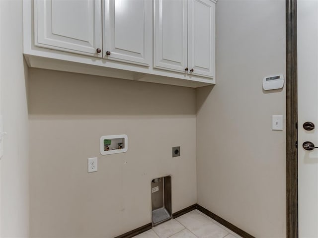 laundry room featuring washer hookup, cabinet space, light tile patterned floors, baseboards, and hookup for an electric dryer