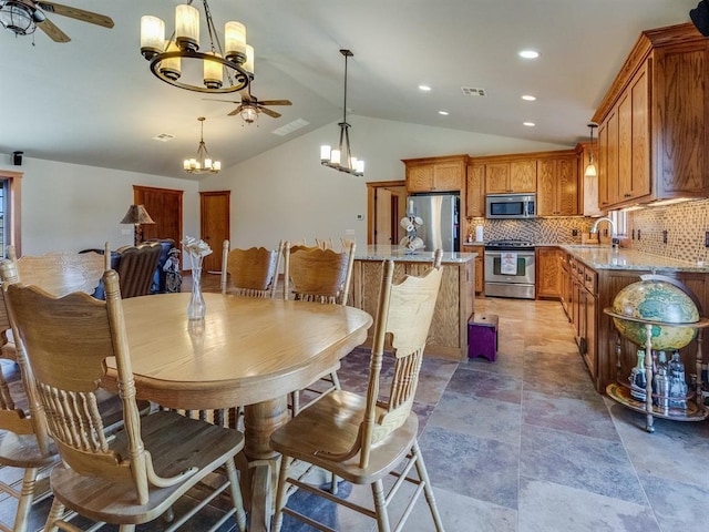 dining area featuring lofted ceiling, recessed lighting, ceiling fan with notable chandelier, and visible vents