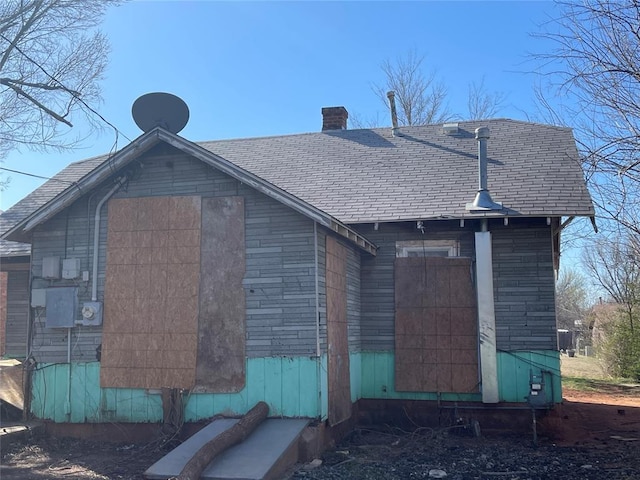 view of home's exterior with a chimney