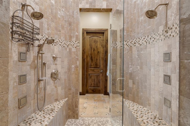 bathroom with a tile shower