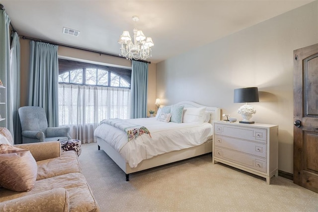 bedroom featuring visible vents and a notable chandelier