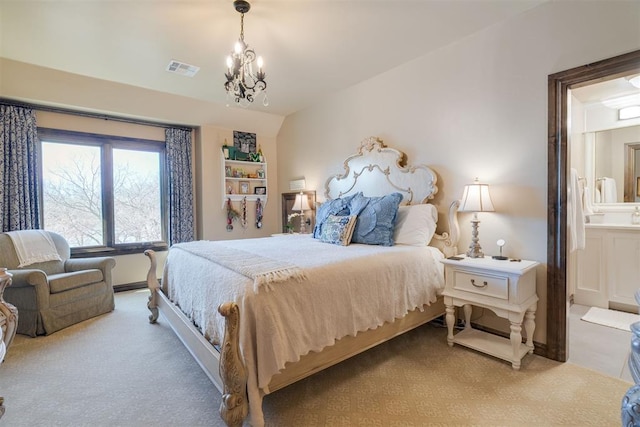 bedroom featuring carpet, visible vents, lofted ceiling, a chandelier, and connected bathroom