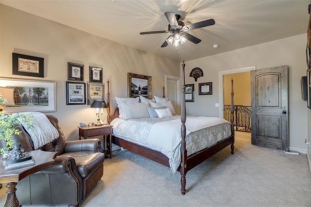 bedroom with light colored carpet and a ceiling fan