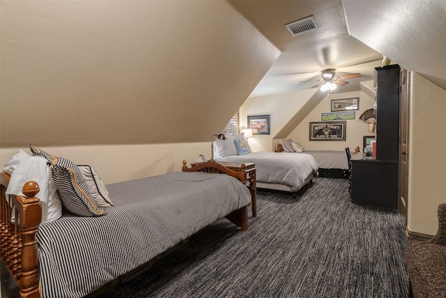 carpeted bedroom with lofted ceiling, visible vents, and ceiling fan