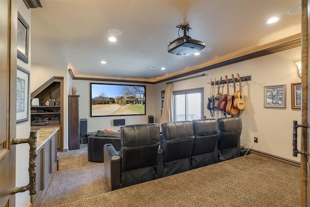 home theater room with recessed lighting, baseboards, light colored carpet, and crown molding