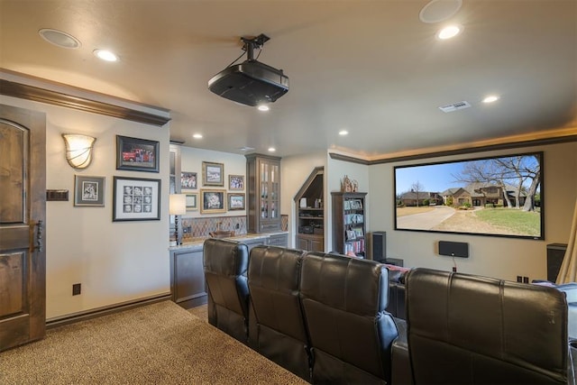 carpeted cinema featuring visible vents, recessed lighting, bar area, and baseboards