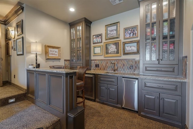 bar with wine cooler, decorative backsplash, recessed lighting, wet bar, and fridge