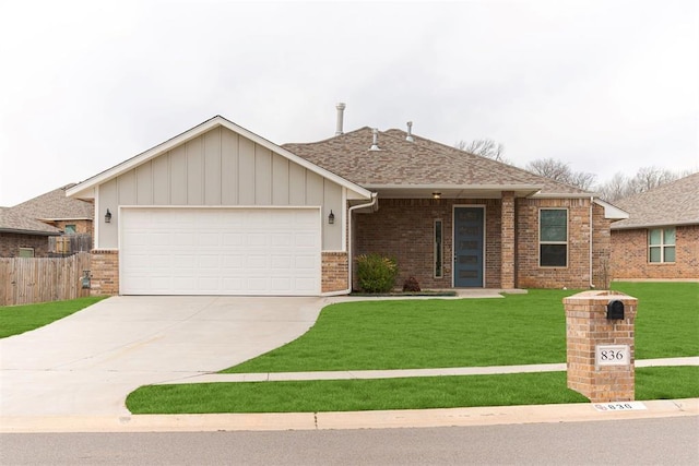 view of front of home featuring brick siding, fence, concrete driveway, a front yard, and an attached garage